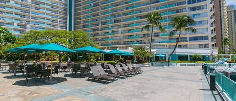 Loungers and tables in the courtyard to watch the surf
