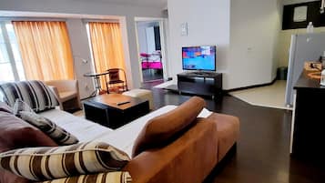 Apartment, 2 Bedrooms, Balcony, Pool View | Living area | Flat-screen TV