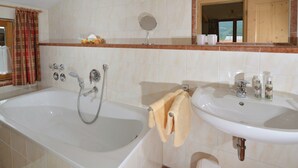 Bathtub, hair dryer, towels