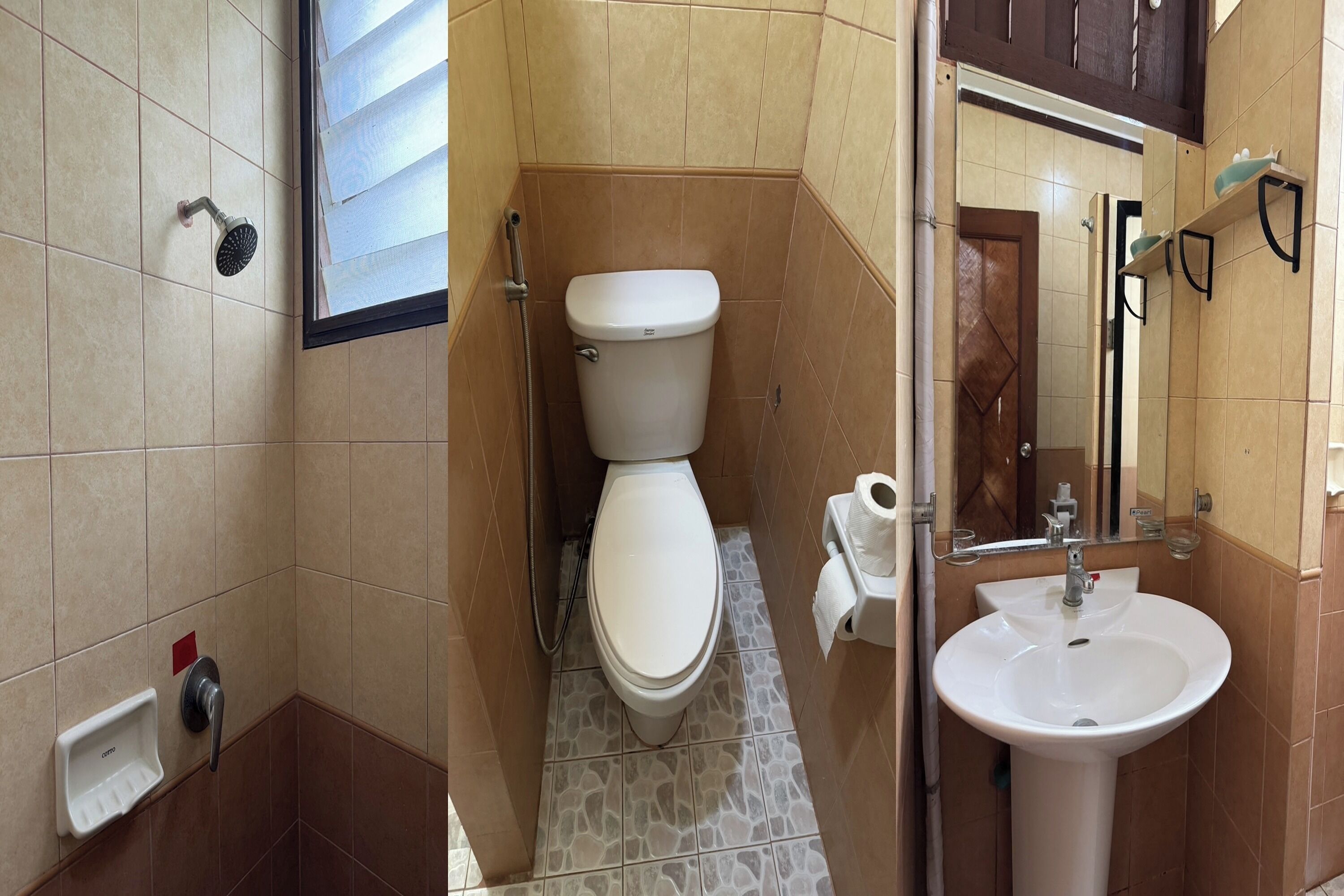 A bathroom with a toilet, a sink, and a shower.