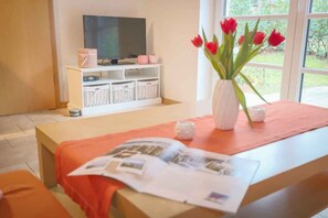 Apartment, 2 Bedrooms, Terrace, Ground Floor (Hühnergott) | Living room | Flat-screen TV - Ferienwohnungen Wald & Meehr (Loddin)