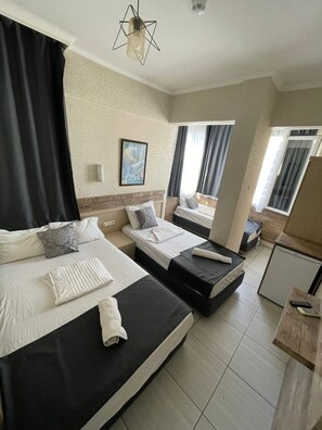 Classic Quadruple Room | Premium bedding, desk, laptop workspace, soundproofing