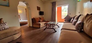 Suite | Area soggiorno | TV a schermo piatto