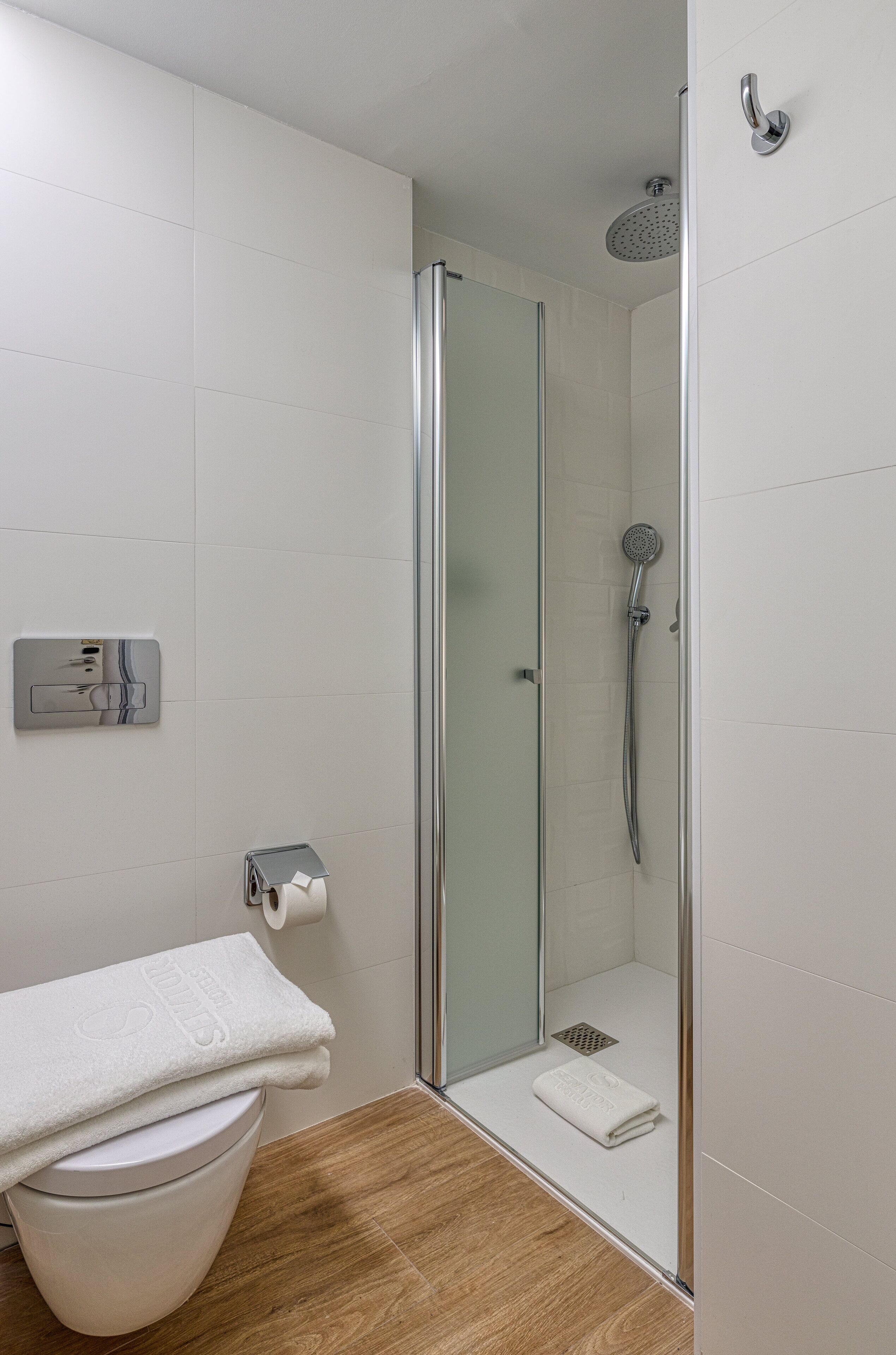 shower, eco-friendly toiletries, hair dryer, towels