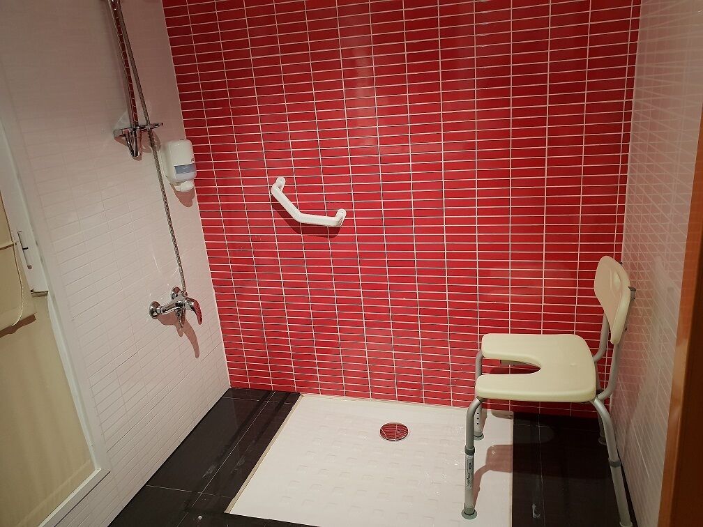 twin room, accessible | bathroom | shower, hair dryer, towels, soap