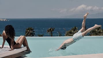 Seasonal outdoor pool, open 8:30 AM to 6:00 PM, pool loungers