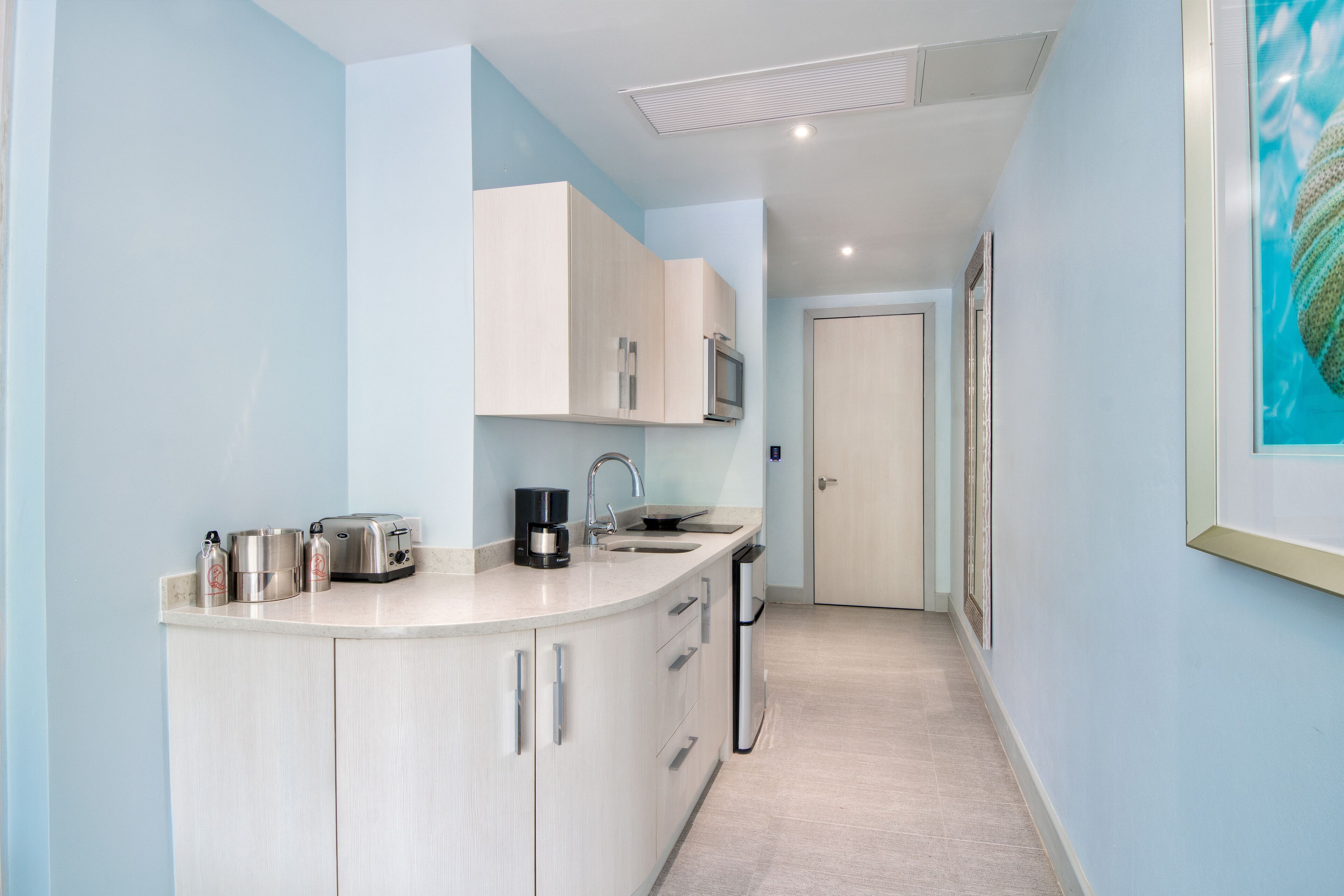 mini-fridge, microwave, stovetop, coffee/tea maker