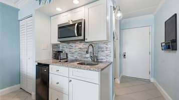 Fridge, microwave, stovetop, coffee/tea maker