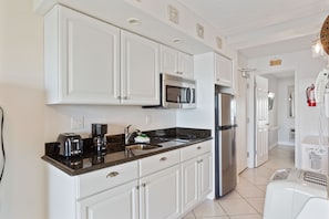 Fridge, microwave, stovetop, coffee/tea maker