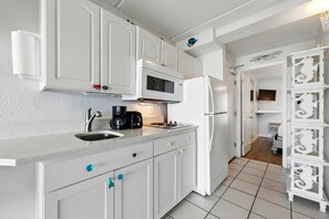 Fridge, microwave, stovetop, coffee/tea maker