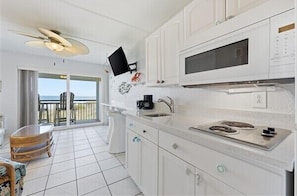 Fridge, microwave, stovetop, coffee/tea maker