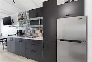 Fridge, microwave, stovetop, coffee/tea maker