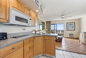 Fridge, microwave, stovetop, coffee/tea maker