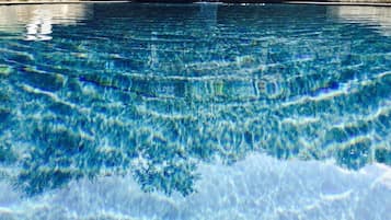 Seasonal outdoor pool, open 7:00 AM to 11:00 PM, pool loungers