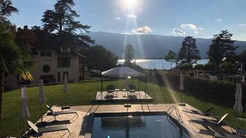 Seasonal outdoor pool, pool umbrellas, sun loungers