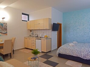 Standard Studio, Sea View | Living area | Flat-screen TV