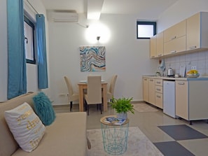Standard Studio, Sea View | Living area | Flat-screen TV