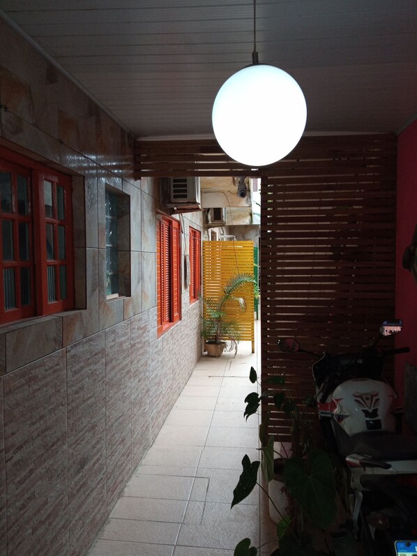 Corridors feature a mix of brick and stone walls, with a potted plant adding a touch of greenery.