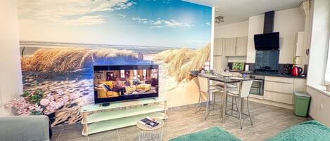 TV, biblioteca musical, aparelho de som
