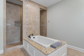 Combined shower/bathtub, jetted bath, hair dryer, towels - Custom Built Lake House (Gulfport)