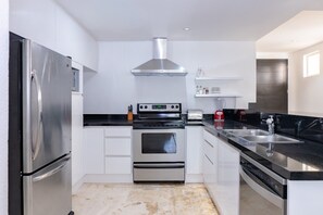 Condo, 2 Bedrooms | Private kitchen | Fridge, oven, coffee/tea maker, toaster