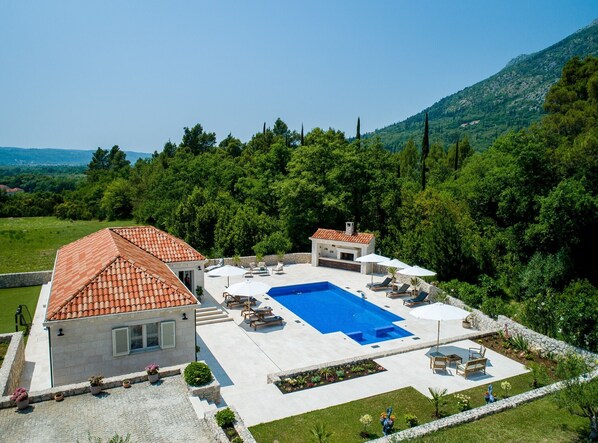 A heated pool, pool loungers