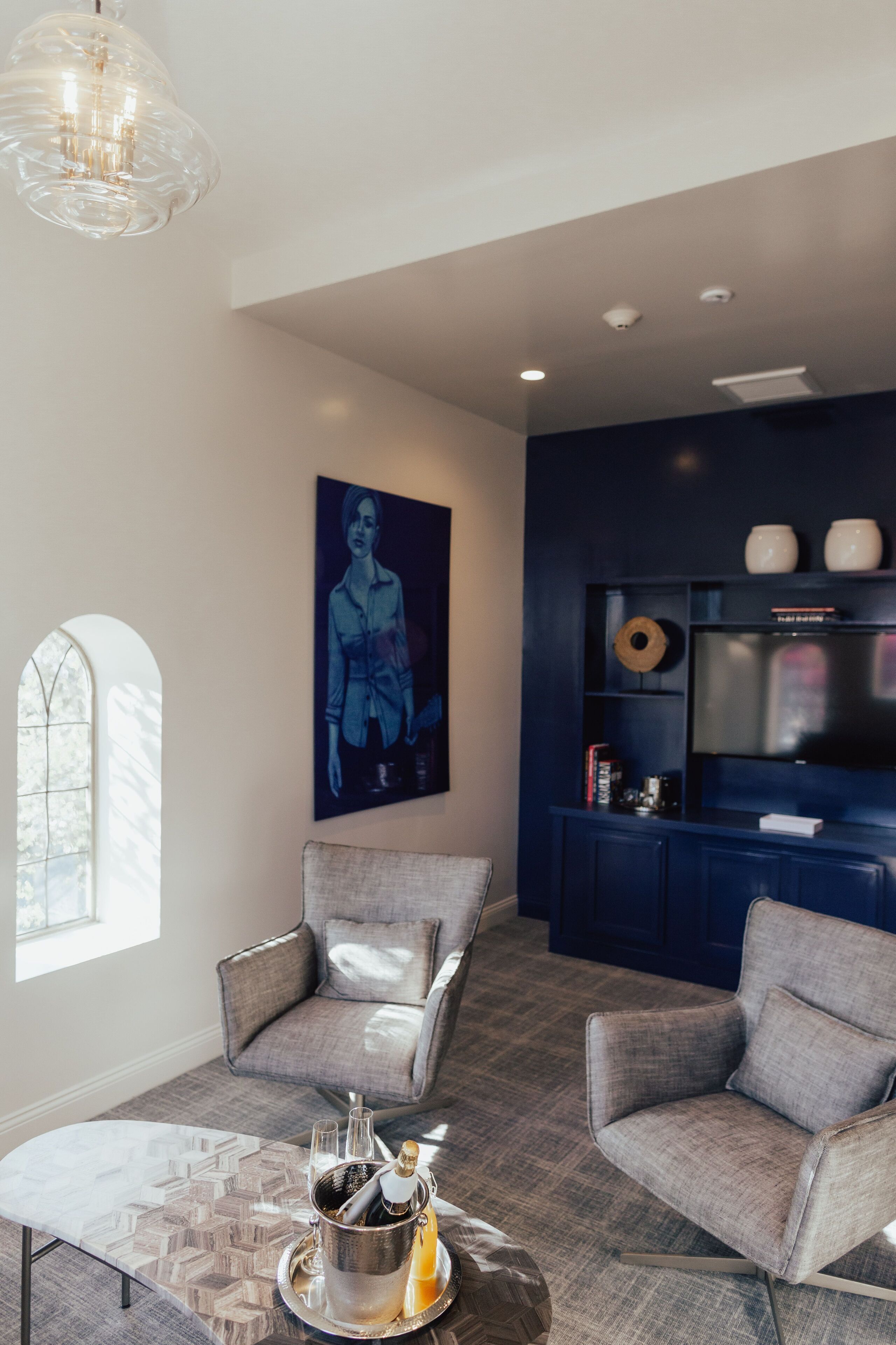 clocktower suite | living area | 50-inch flat-screen tv with cable channels, tv