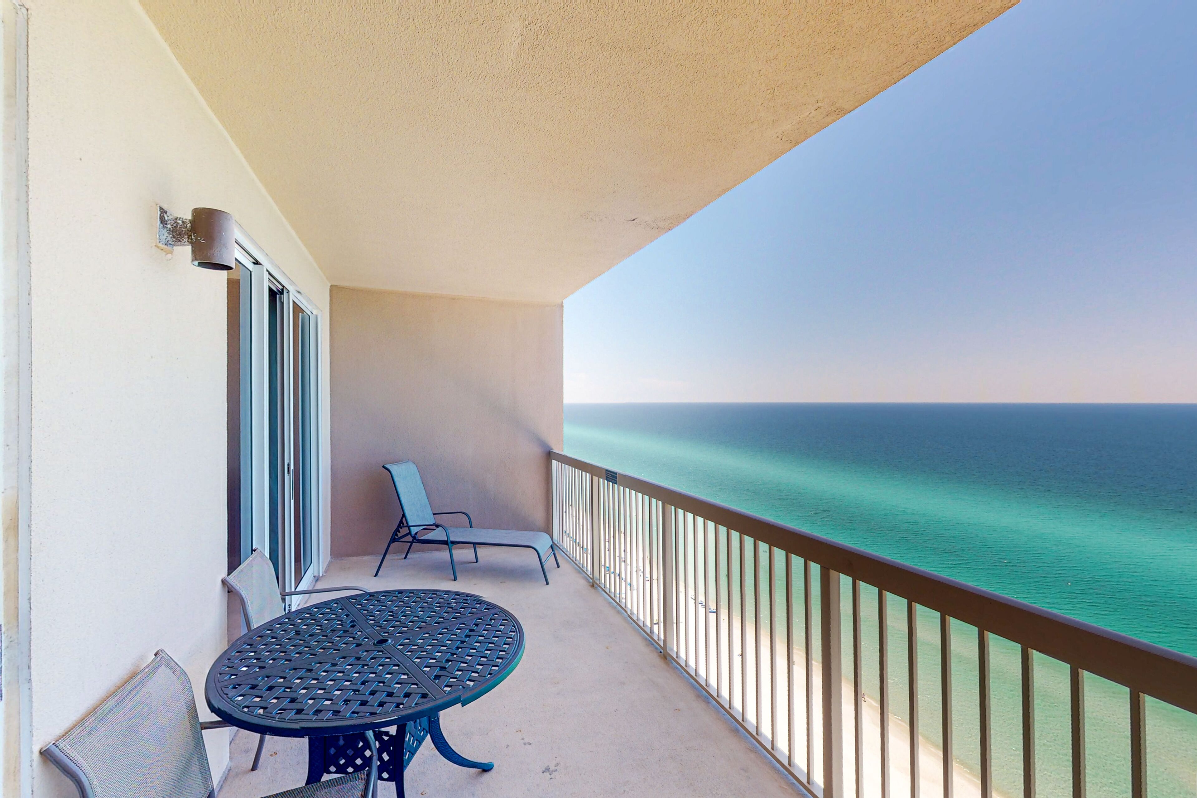 Elegant, beachfront condo with a furnished balcony, views & two pools
