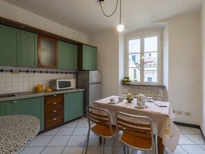 Oven, toaster, freezer, dining tables