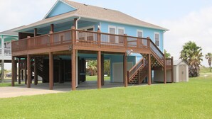 A two-story house with a covered porch and a staircase leading to a second level. - Shore Fun! 3/2 Beachhouse, Holiday Beach Subdivision, Close to Everything! (Port Bolivar)