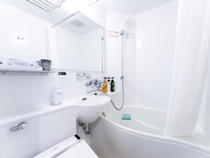Combined shower/tub, free toiletries, hair dryer, slippers