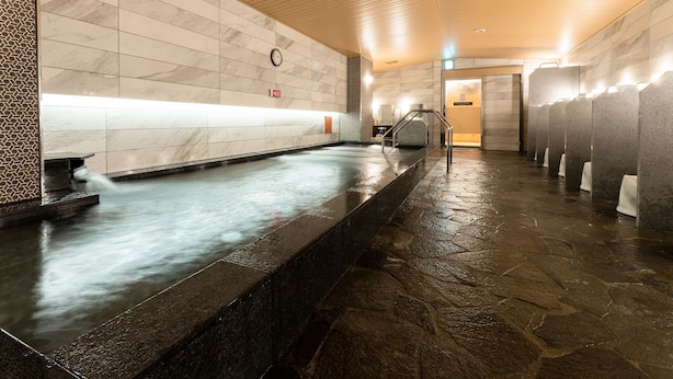 A public restroom with a long, narrow sink area, a wooden ceiling, and tiled walls. - APA Hotel Omori Ekimae (Tokyo)