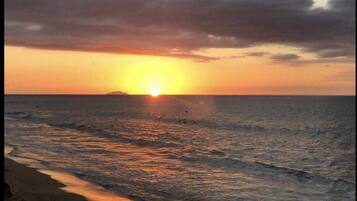 On the beach, sun loungers