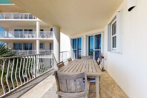 Enjoy dining or socializing on the balcony with a view of the surrounding buildings.