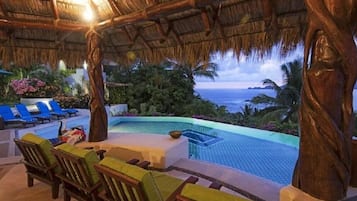 A heated pool, pool loungers