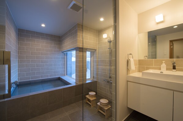 Chalet, 1 Bedroom | Bathroom | Combined shower/tub, deep soaking tub, hair dryer, slippers