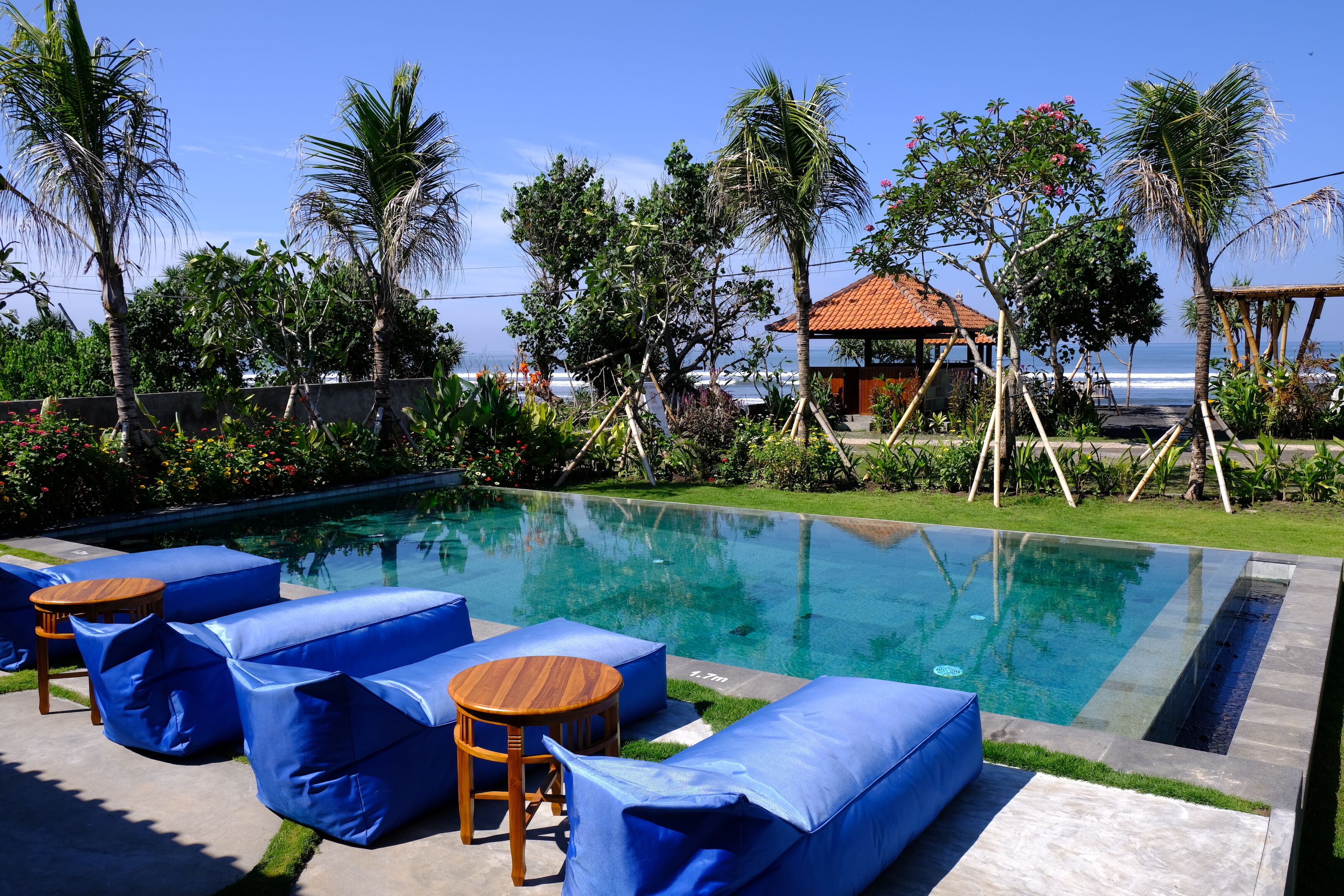 2 outdoor pools, open 7:00 AM to 8:00 PM, pool umbrellas, pool loungers