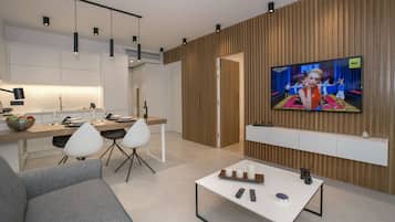 Design Apartment, 1 Bedroom, Garden View, Ground Floor | Living area | 43-inch flat-screen TV with satellite channels, TV