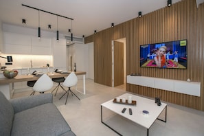 Lägenhet Design - 1 sovrum - utsikt mot trädgården - bottenvåning | Vardagsrum | 43-tums platt-tv med satellitkanaler och tv