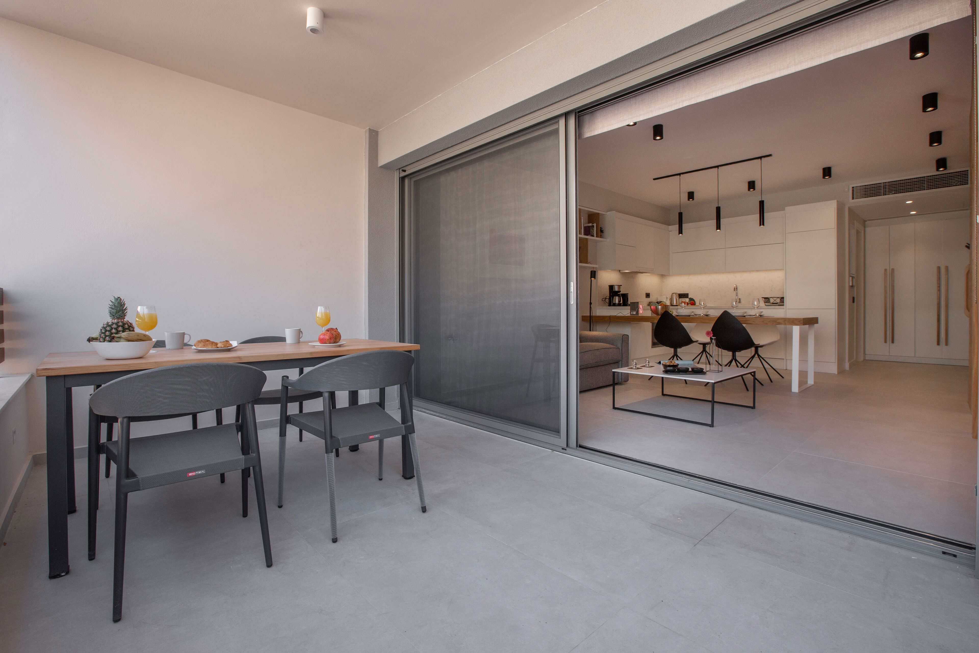 A modern kitchen with a dining area.