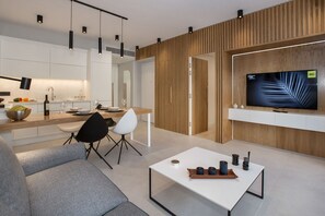 Design Apartment, 1 Bedroom, Balcony (2) | Living room | 43-inch flat-screen TV with satellite channels, TV - Acropolis Golden Suites by GHH (Athens)