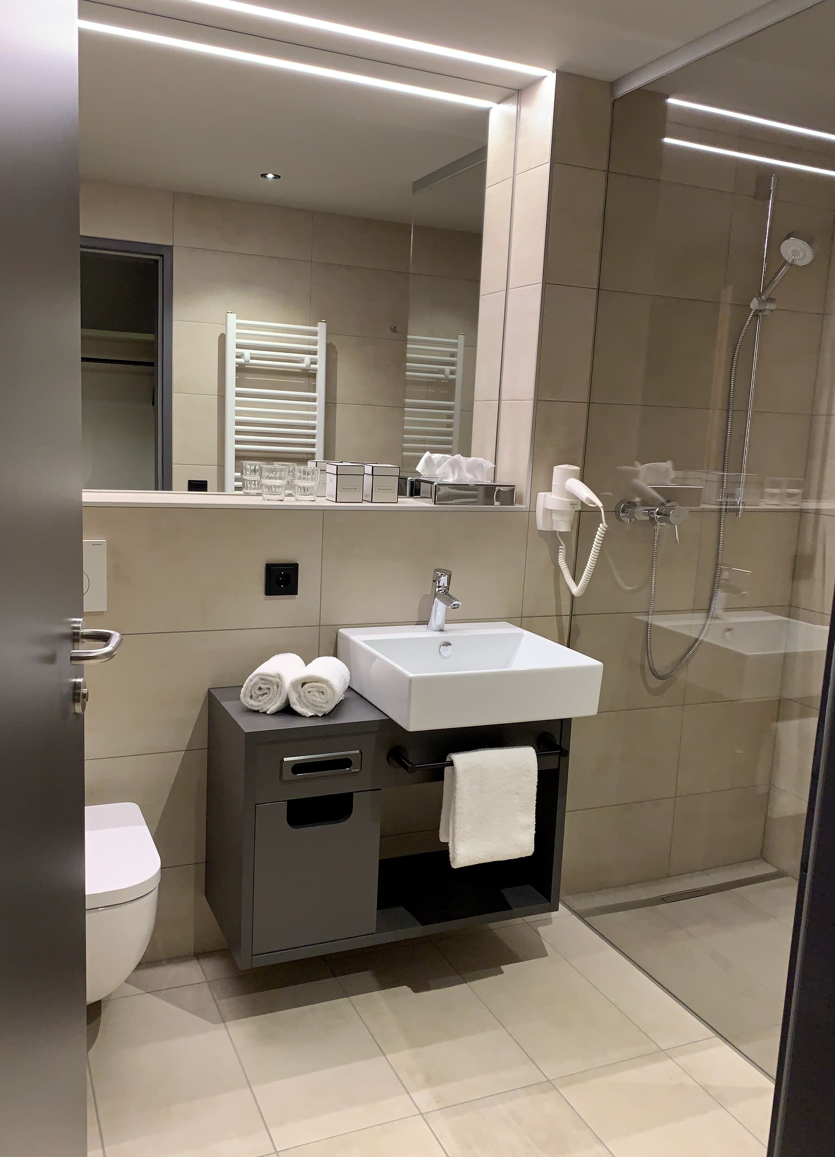 shower, hair dryer, towels, soap