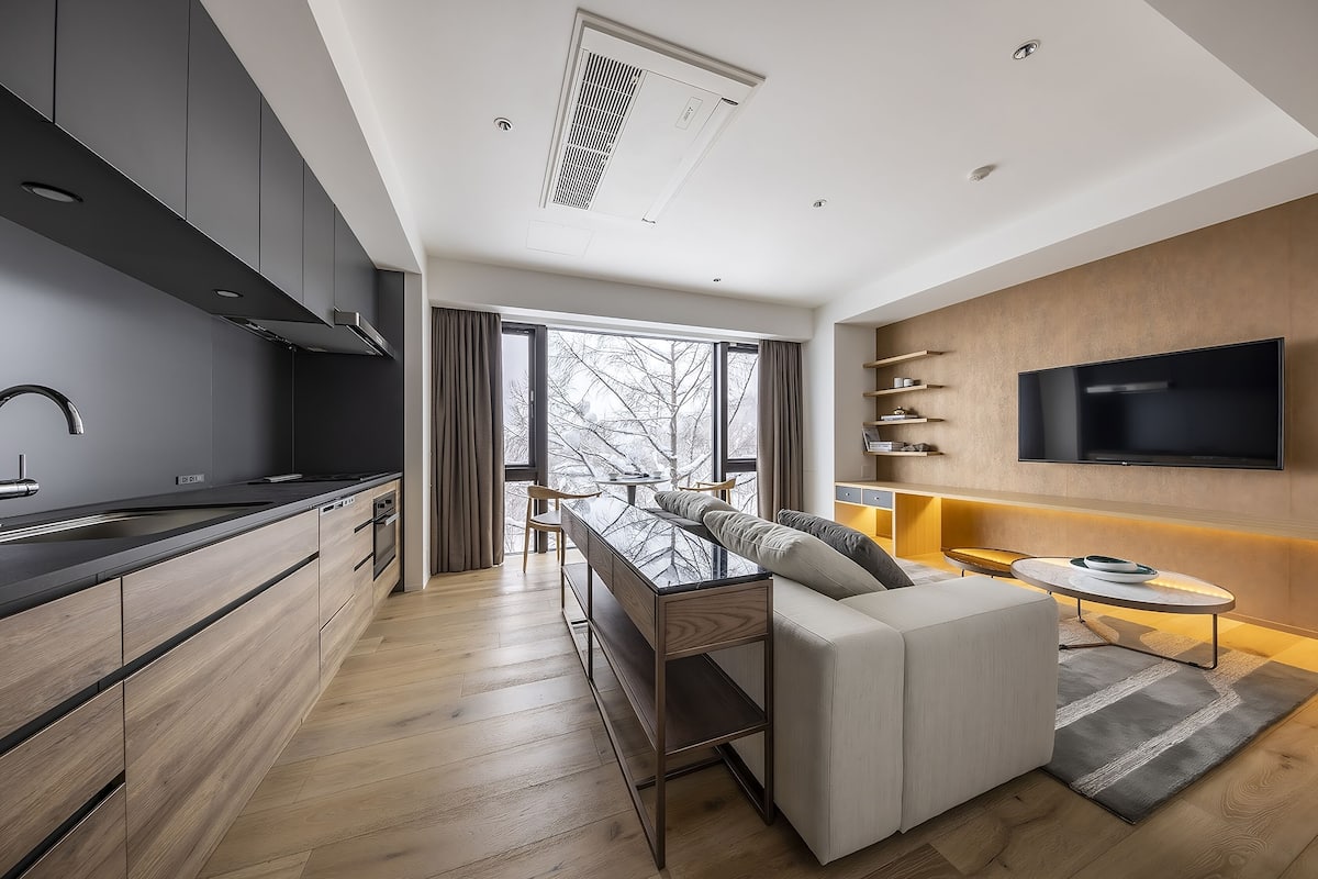 1 Bedroom Suite | Living area | Flat-screen TV, heated floors