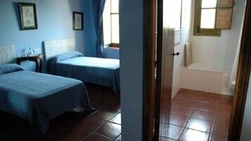 Combined shower/bathtub, deep-soaking bathtub, towels, soap