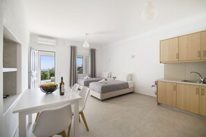 Apartment, 1 Bedroom | Living area | Flat-screen TV - Oniropetra Apartaments (Mykonos)