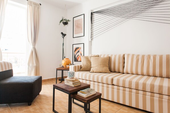 Apartment, 1 Bedroom | Living area | 32-inch flat-screen TV with cable channels, Smart TV, Netflix