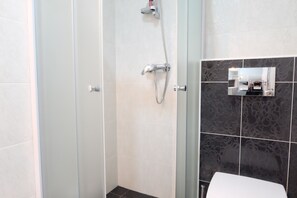 Shower, rainfall showerhead, hair dryer, towels