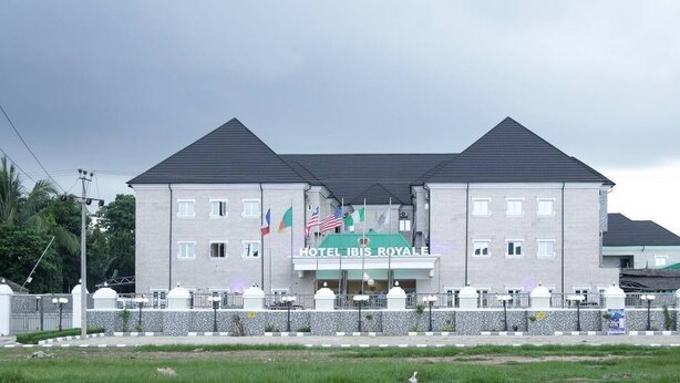 A two-story building with a sign reading "HOTEL IBIS ROYALE". - Hotel Ibis Royale Owerri (Owerri)