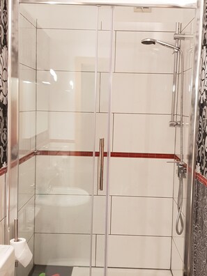Shower, hair dryer, towels, soap