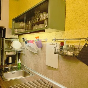 Fridge, microwave, stovetop, coffee/tea maker